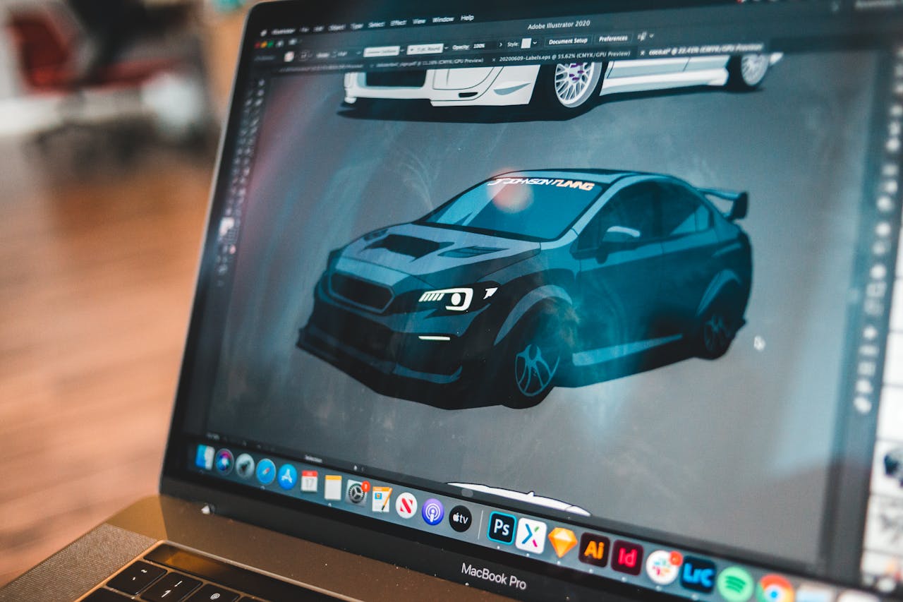 A digital illustration of a car on a laptop screen, showcasing creative automotive design work.